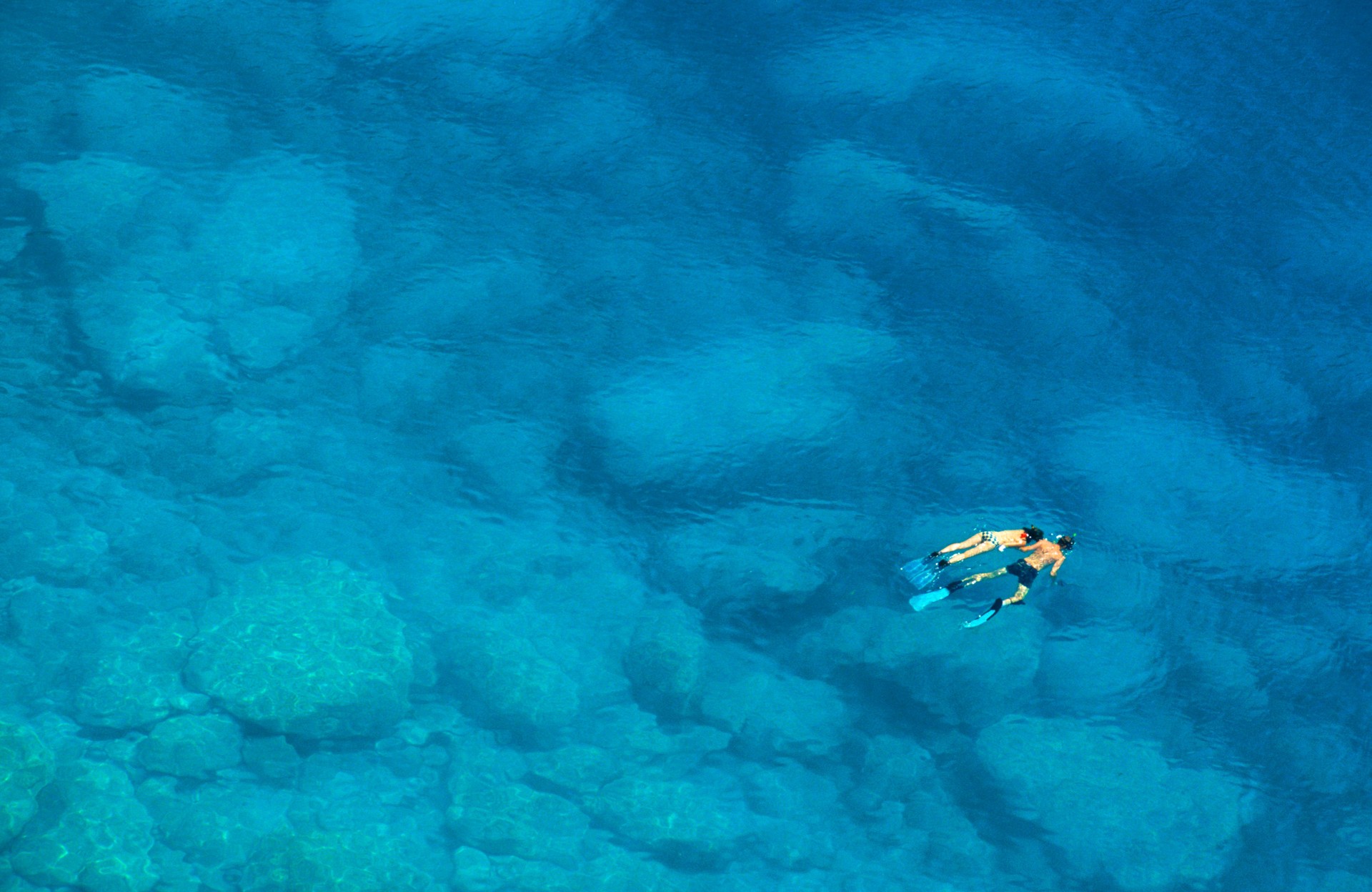 Man and Woman Snorkelling in Blue Mediterranean Sea